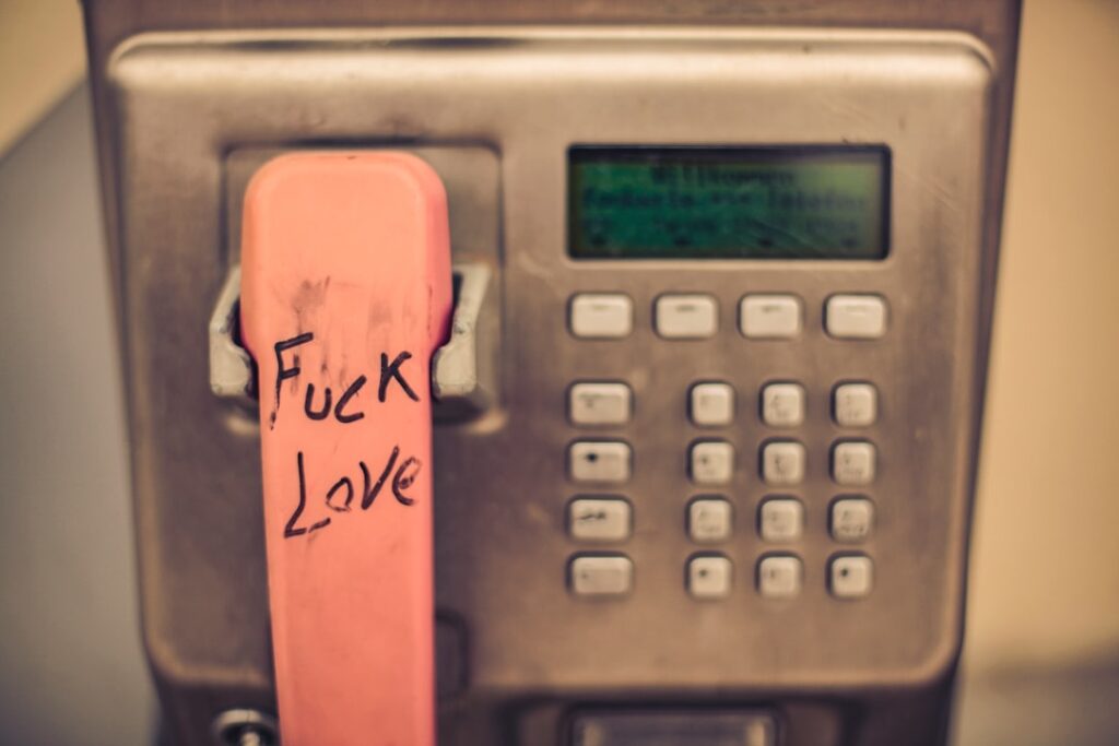 a phone with a pink sticker on the back of it