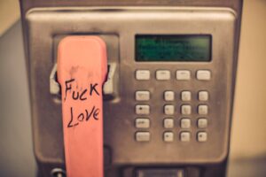 a phone with a pink sticker on the back of it