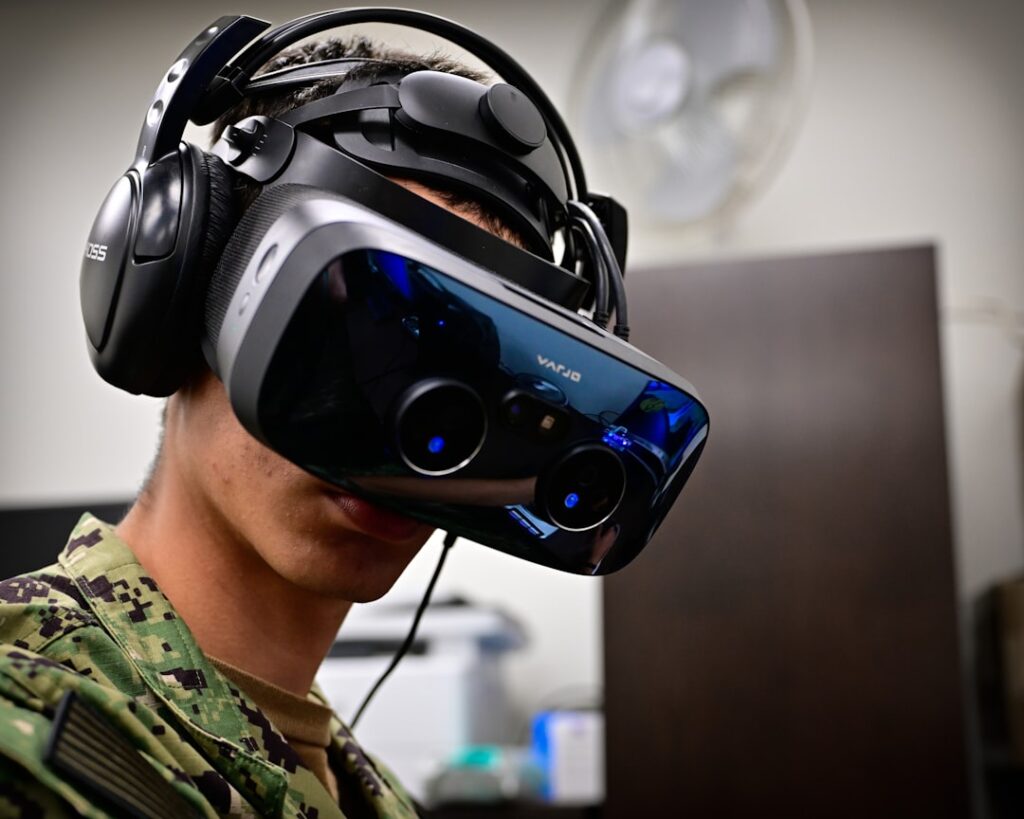 Person wearing a virtual reality headset and headphones.