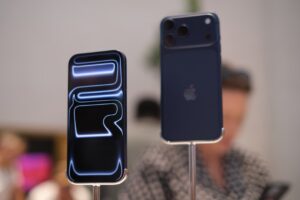 Two smartphones displayed with glowing abstract design.