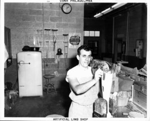 Man working in an artificial limb shop.